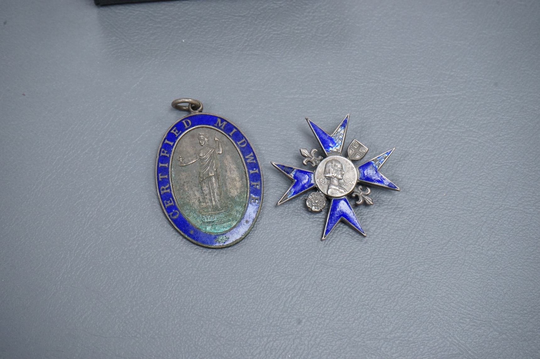 A Nightingale School enamelled ‘Loyalty’ badge, engraved to Audrey Slade, 1948 and a Certified Midwife medallion